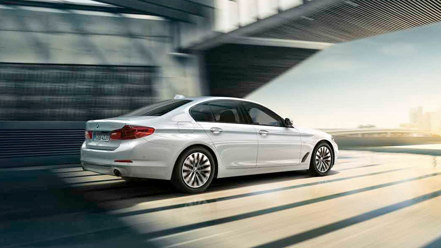 BMW 5 Series Sedan 2020 G30 with Mild Hybrid Technology in white driving